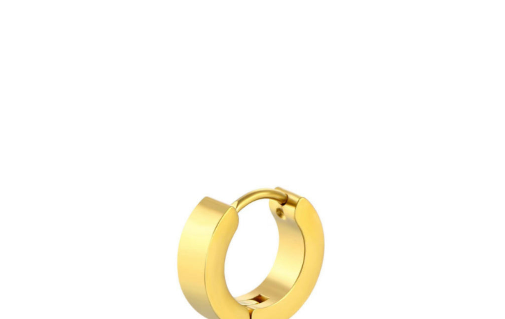 Black geometric titanium earrings on display