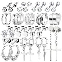 Black hoop and stud earrings laid out beautifully