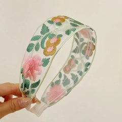 Comfortable fabric floral headband on display