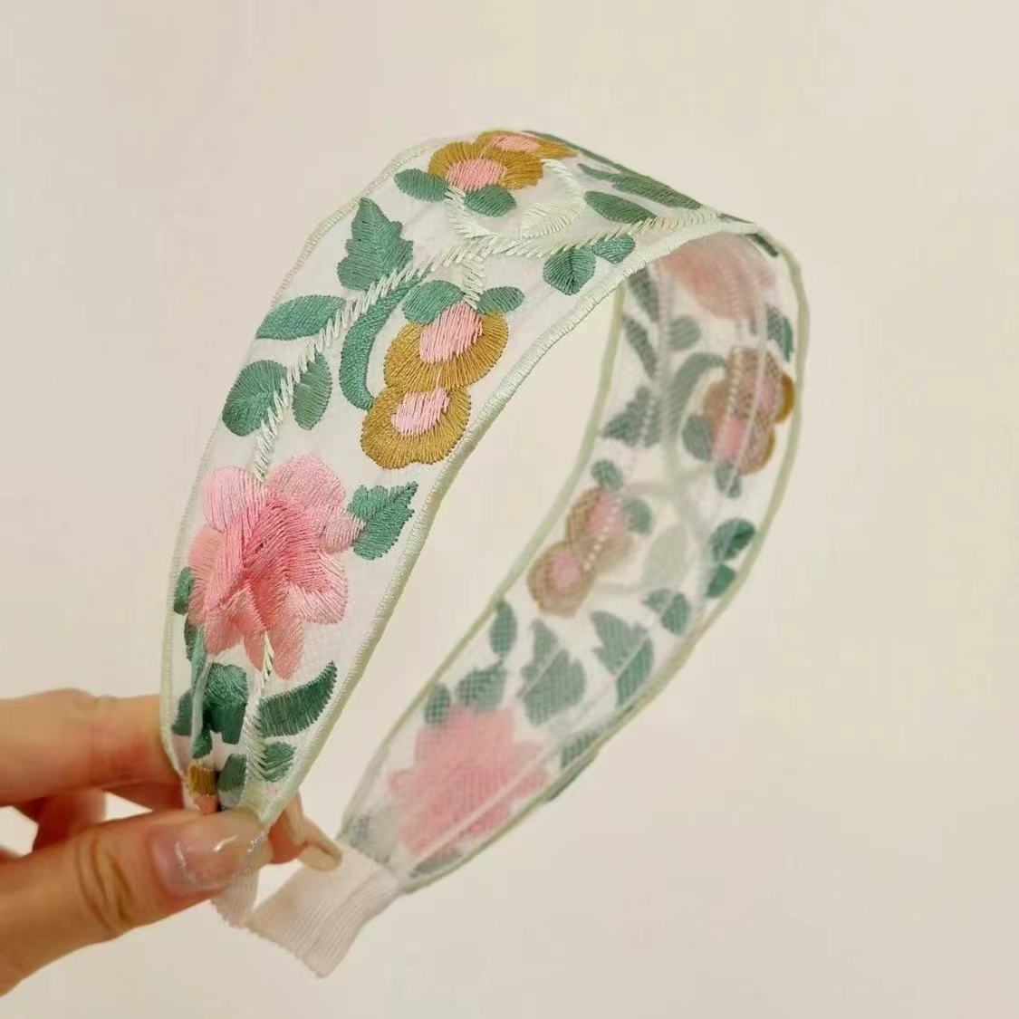 Comfortable fabric floral headband on display