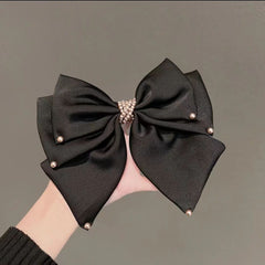 Detailed view of pearl accents on hair clip