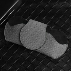 Leather sunglasses case in car
