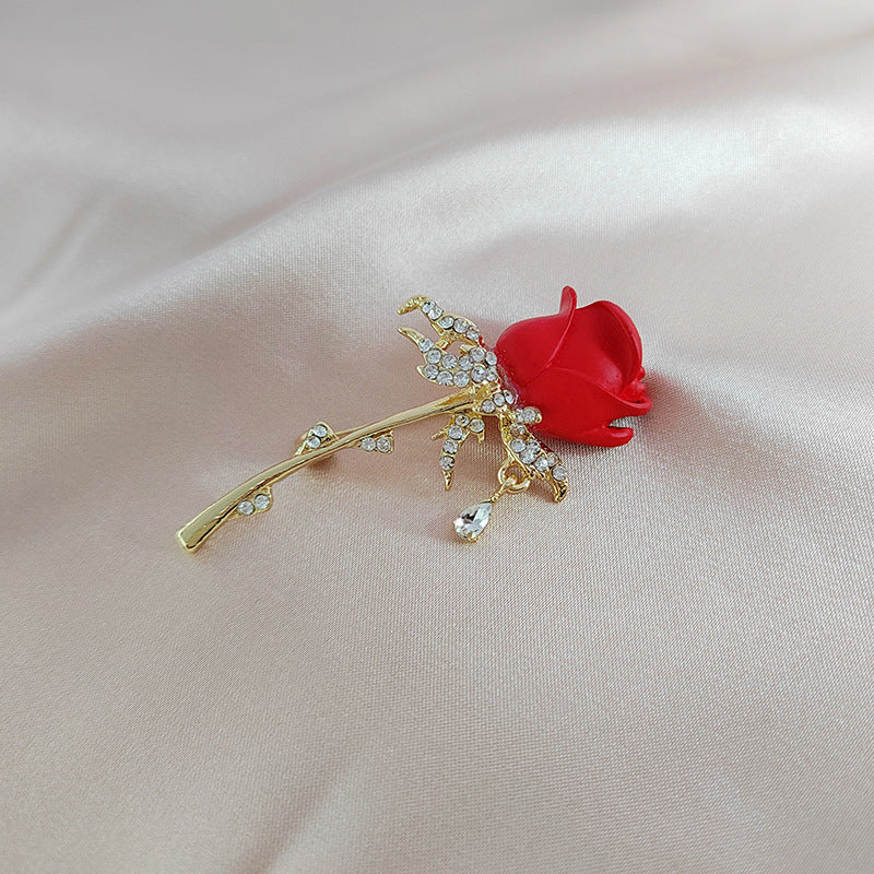 Close-up of rhinestone tulip and rose brooch