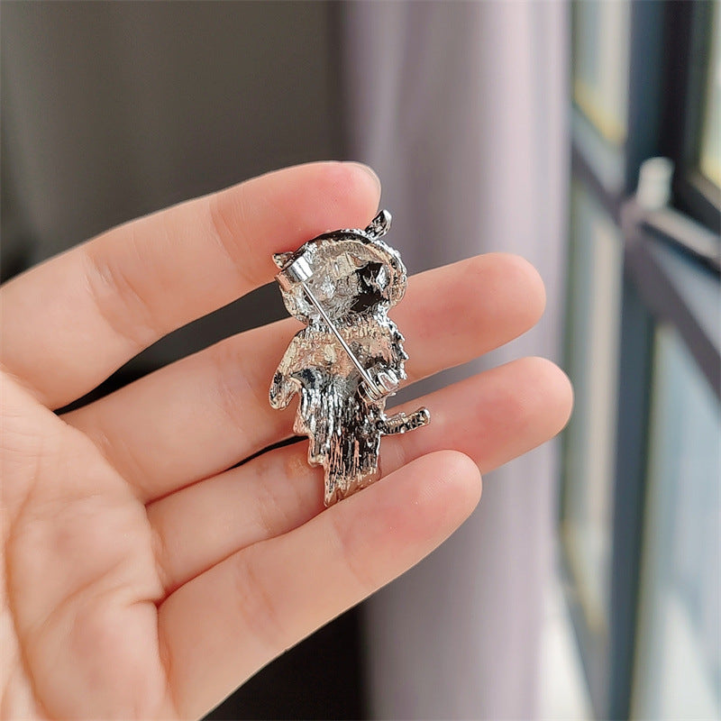 Group View of Various Owl Brooches