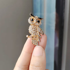 Group View of Various Owl Brooches