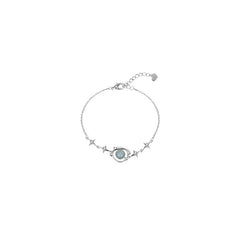 hands wearing blue planet bracelet