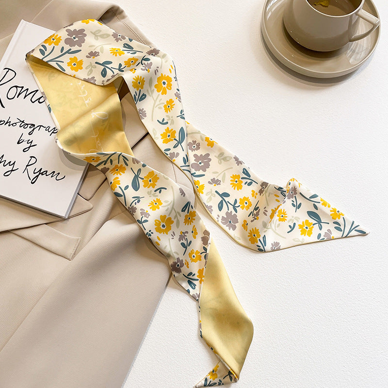 yellow scarf tied to bag