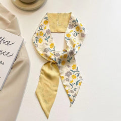 close-up of yellow floral hair scarf fabric