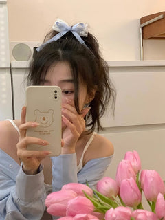 Chic hair clips set against a pastel background