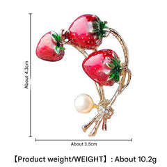 Enamel Strawberry Brooch Displayed on a Light Background