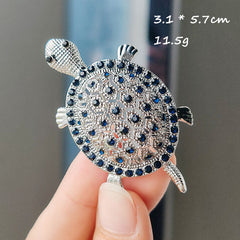 Colourful turtle brooch with shiny finish