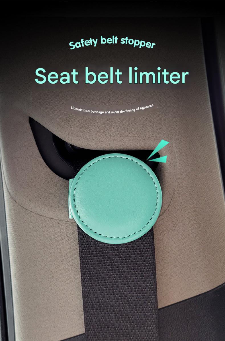 Pink adjustable car seat belt clip in car