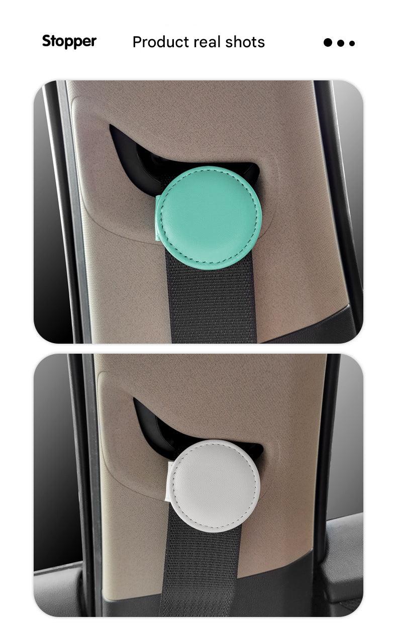 Black adjustable car seat belt clip on display