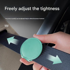 Blue adjustable car seat belt clip close-up