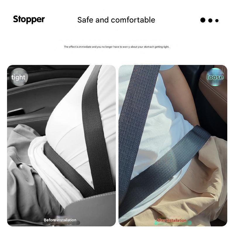 Pink adjustable car seat belt clip in car
