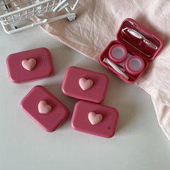 Portable contact lens case in stylish pink design