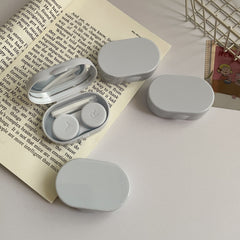 Portable contact lens case in stylish pink design