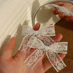 Charming blue bow hair clip styled on child's hair