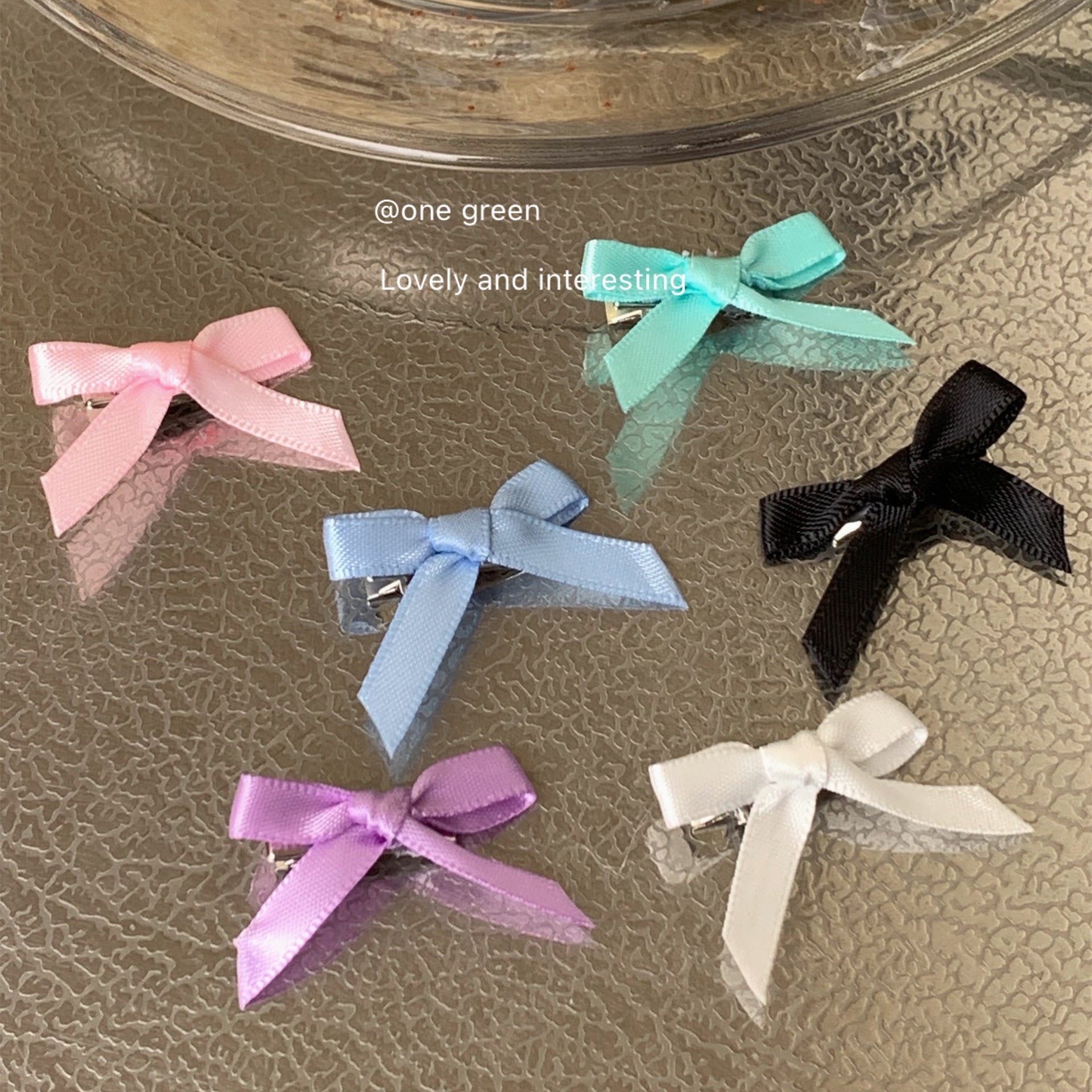 Charming blue bow hair clip styled on child's hair