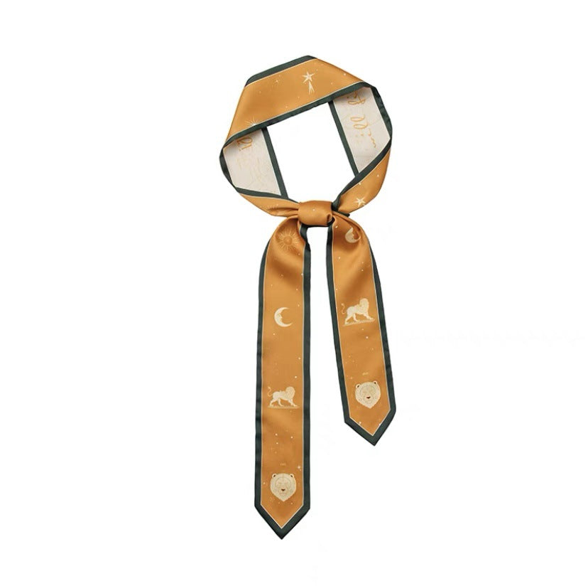 Zodiac silk scarf laid flat to show patterns