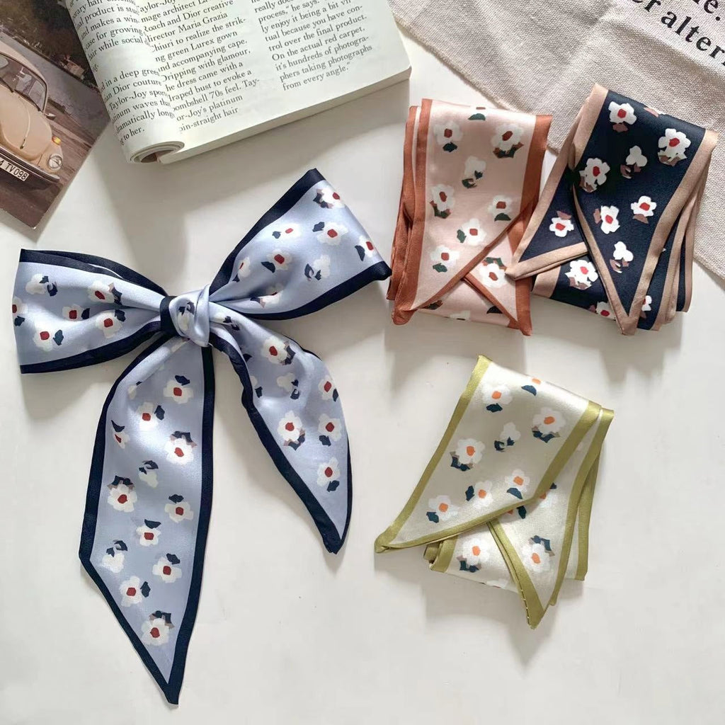 Elegant daisy print scarf worn as headband image 2
