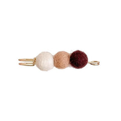 Black elegant cardigan brooch on display