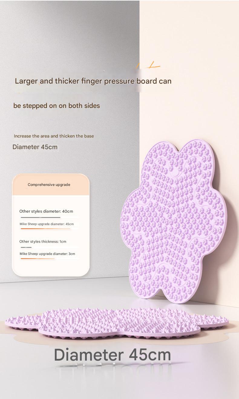 Acupressure mat next to yoga equipment