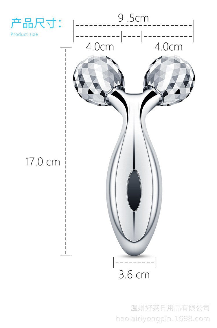 User rolling facial massager over skin