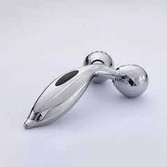Facial massager displayed with skincare products