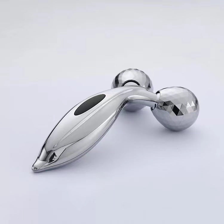 Facial massager displayed with skincare products