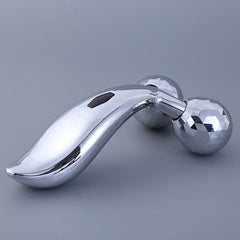 Facial massager displayed with skincare products