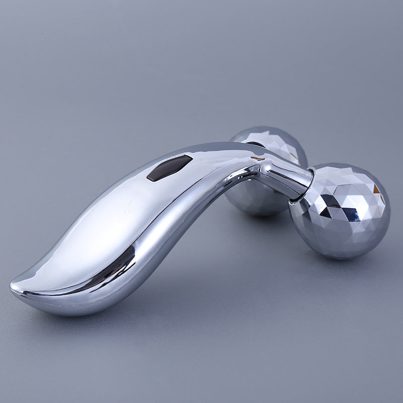 Facial massager displayed with skincare products