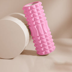 Foam roller yoga stick on a workout mat