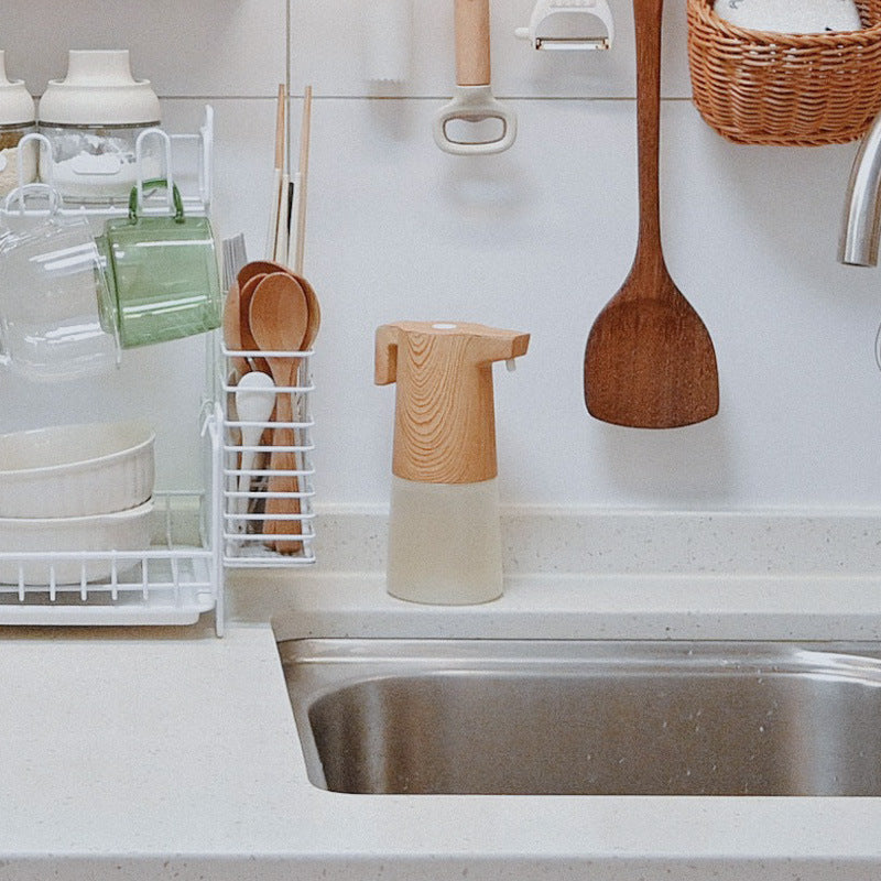 Side view of automatic soap dispenser in kitchen