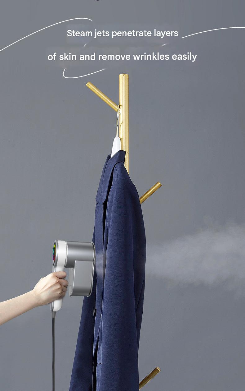 Portable steam iron close-up with controls