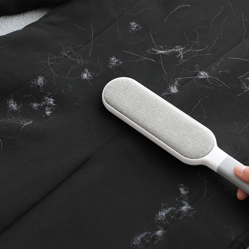 Double-sided hair brush displaying pet hair removal