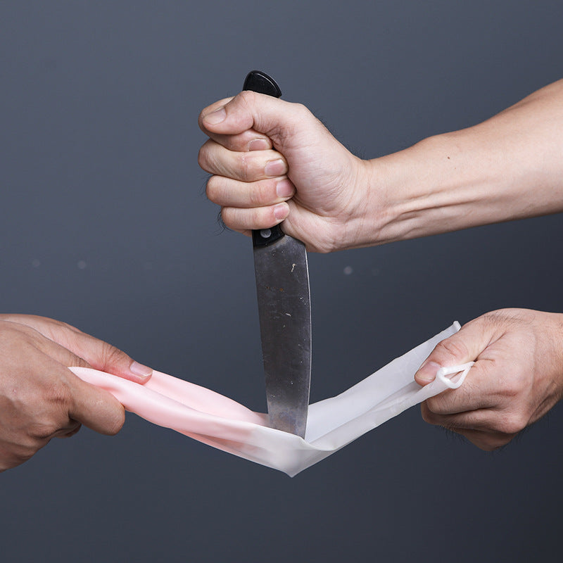 Close-up of cleaning gloves on a kitchen counter