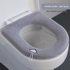 Universal fit plush toilet seat cover over a toilet seat
