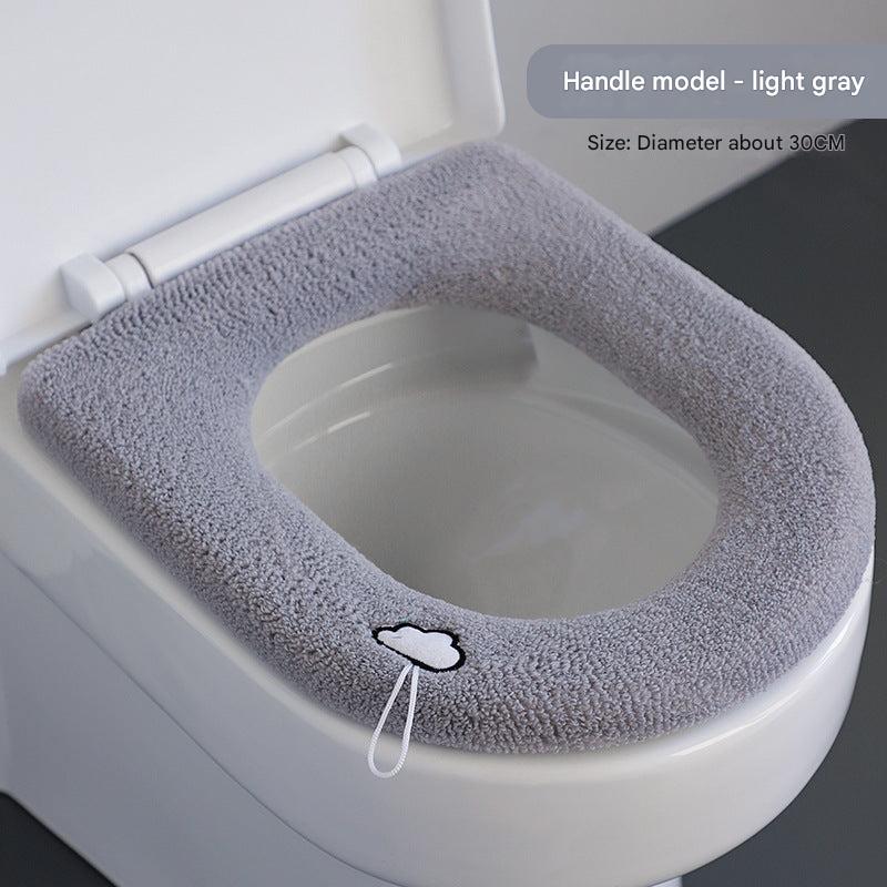 Universal fit plush toilet seat cover over a toilet seat