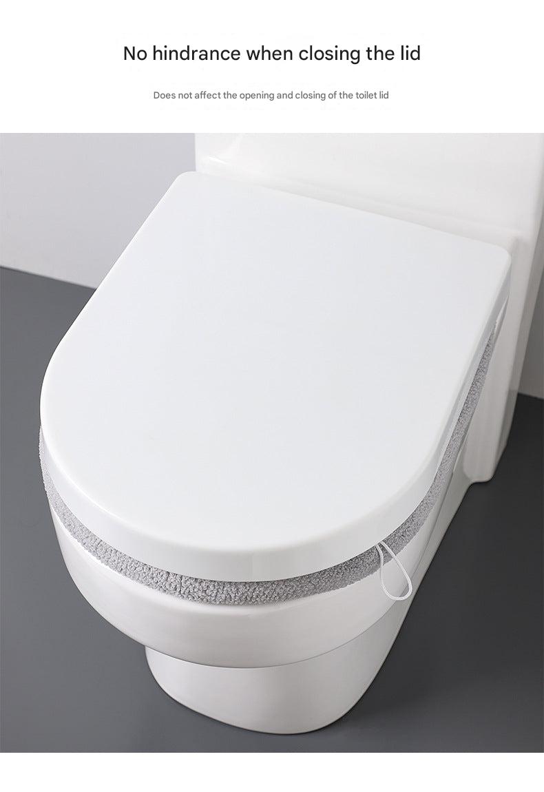 Universal fit plush toilet seat cover over a toilet seat