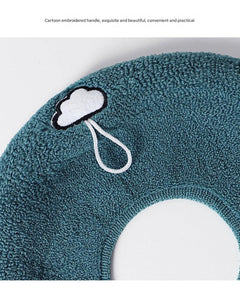 Stylish dark green toilet seat cover in a bathroom setting