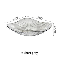 Elegant grey fruit bowl with fruits