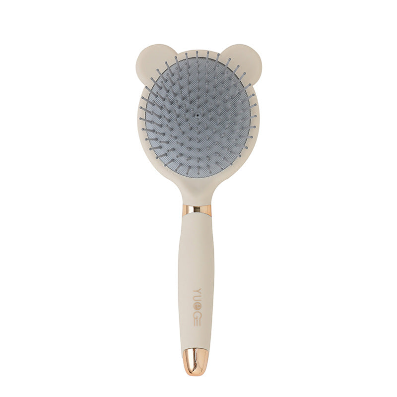 Styling hair with the portable brush.