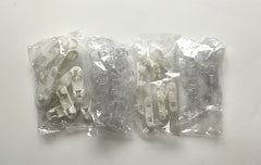 Self-adhesive clips holding multiple cables