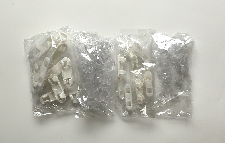 Self-adhesive clips holding multiple cables