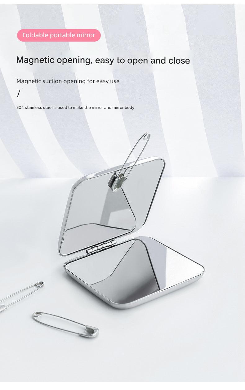 Compact makeup mirror open for use