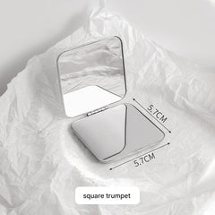Folding mirror reflecting make-up application