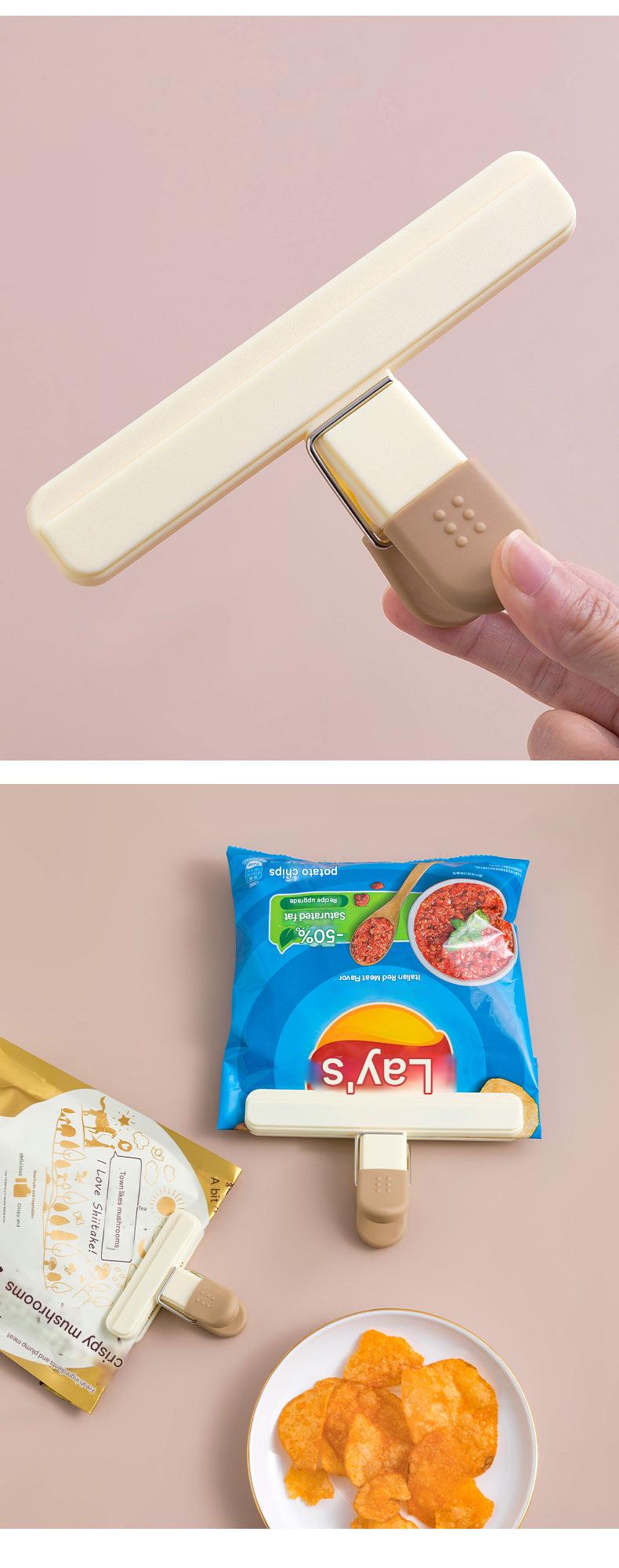 Food sealing clips in use for sealing snack bags