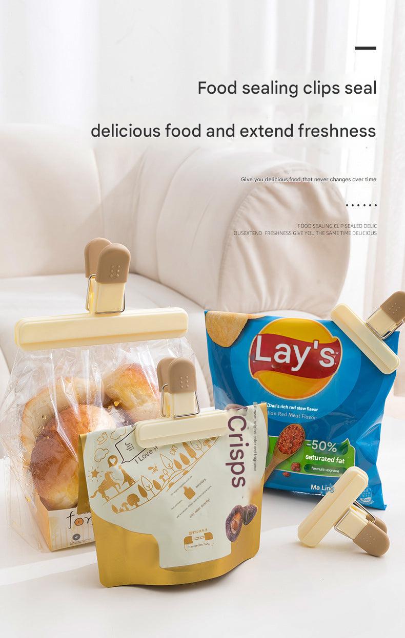 Food sealing clips in use for sealing snack bags