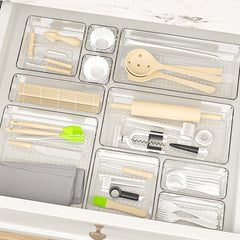 Clear organiser box with various small items